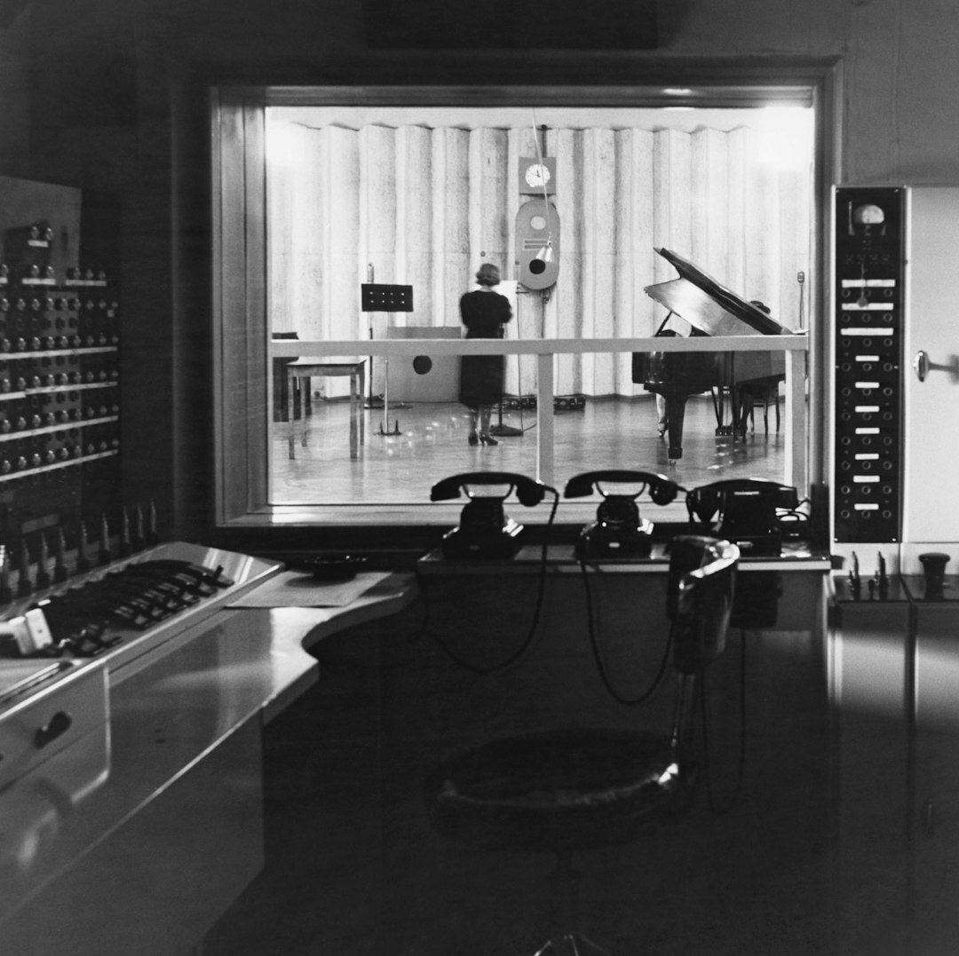Wide shot of a professional radio studio control room